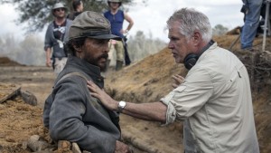 Director Gary Ross and Matthew McConaughy go over their battle plan.